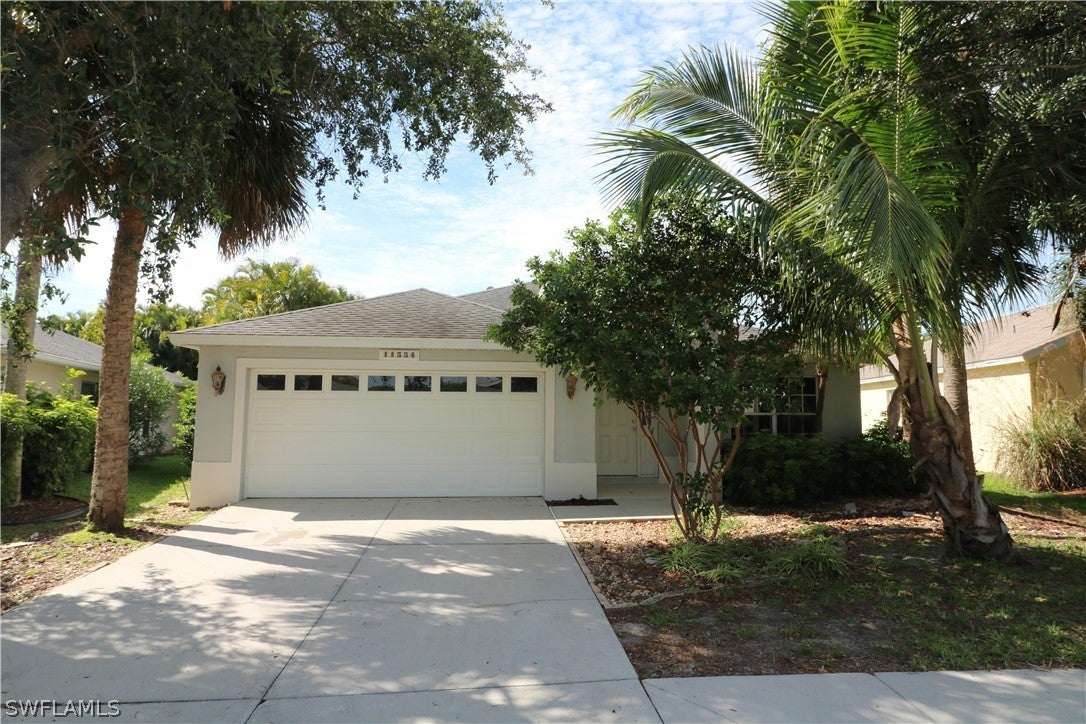 SW Florida Real Estate - View SW FL MLS #222040617 at 11554 Woodmount Ln in STONEYBROOK in ESTERO, FL - 33928