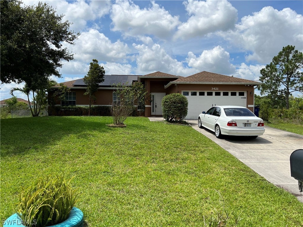 SW Florida Real Estate - View SW FL MLS #222047719 at 3421 22nd St W in LEHIGH ACRES in LEHIGH ACRES, FL - 33971