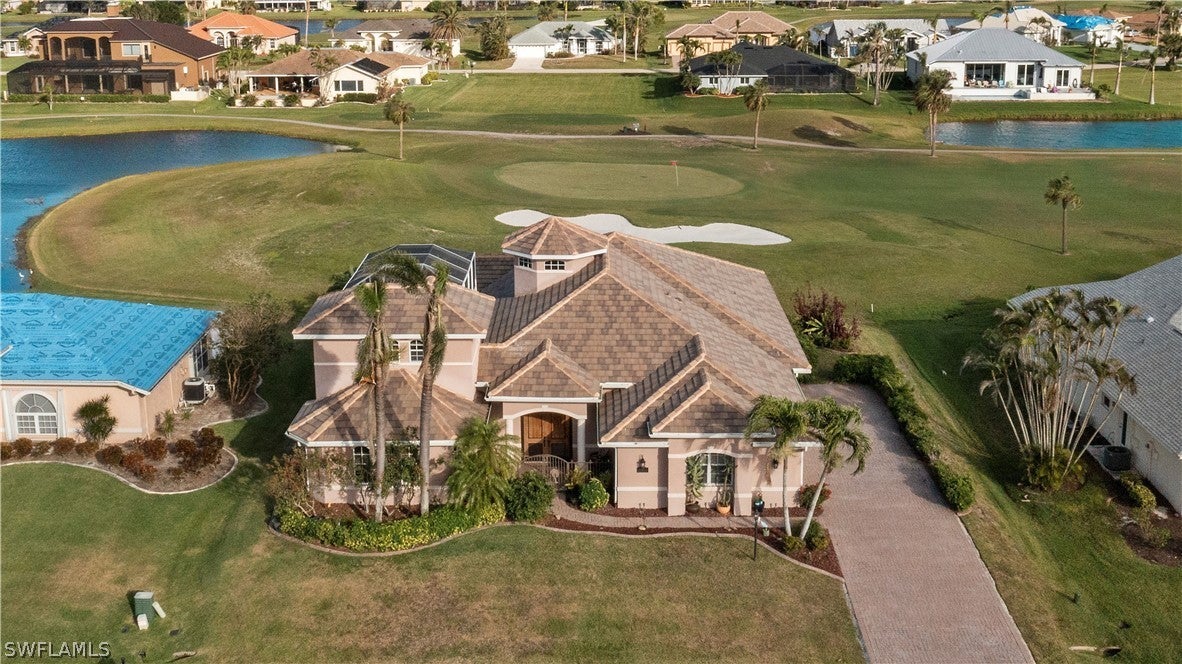 SW Florida Real Estate - View SW FL MLS #223011758 at 11894 Royal Tee Cir in CAPE ROYAL in CAPE CORAL, FL - 33991